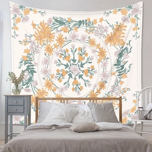 Detail of bohemian mandala tapestry featuring yellow and lavender floral design for home decor