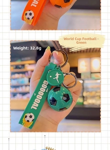 Close-up of green soccer keychain with rubber wristband and football charm, weight 32.8g