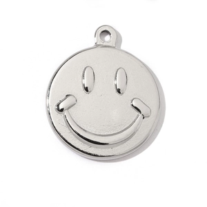 Close-up of polished silver stainless steel smiley face pendant for DIY jewelry