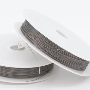 DIY jewelry steel wire spools in gray metal for bead stringing and bracelet making