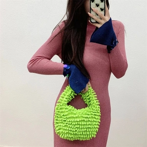 Detail of the neon green plush handbag with unique textured fabric and candy color style