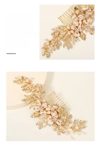 Detailed close-up of handmade bridal hair comb with gold leaves and white pearls