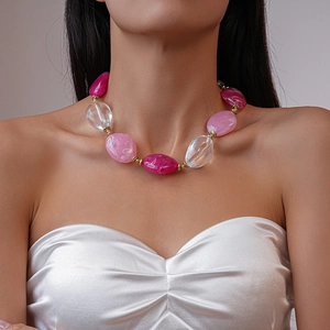 Bohemian beaded shell necklace with magenta resin pebbles and gold metal accents