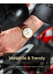 Detail of men's quartz watch with gold case, brown leather strap and dual calendar display