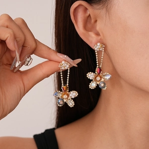 Elegant floral drop earrings with colorful crystals and pearls in luxury gold finish