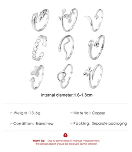 Detailed size and material specs for a 9-piece silver butterfly and leaf toe ring set