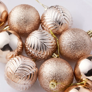 Rose gold Christmas ornament set with glitter balls and embossed leaf pattern spheres