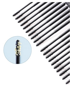 Macro detail of black spiral adhesive ear cleaner tip showing textured surface for earwax