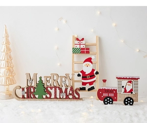 Detailed view of wood Merry Christmas signs with Santa Claus and festive XMAS train set
