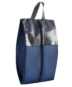 Detail of travel shoe bag featuring navy nylon fabric and silver snakeskin texture
