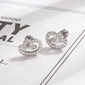 Minimalist silver wing earrings with micro-inlaid cubic zirconia and secure screw back