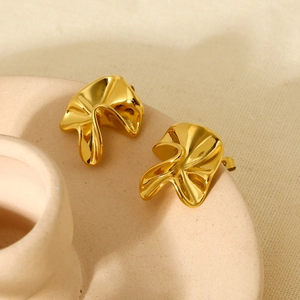 Detail showing the 18k gold plated irregular hammered texture and molten flow of the earrings