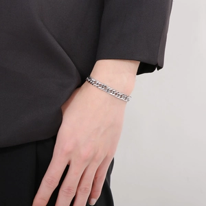Polished silver cuban chain bracelet for men with OT buckle shown on male wrist