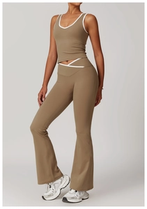 Detail of high-waisted yoga set with contrast binding and crossover flare pants design