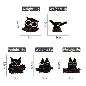 Detailed view showing five black cat enamel pins with dimensions and weight specifications