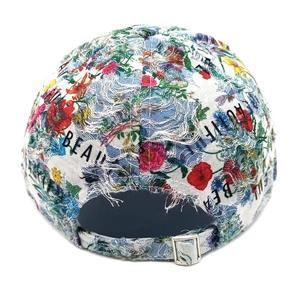 Detailed back view of distressed denim floral baseball cap with adjustable metal buckle