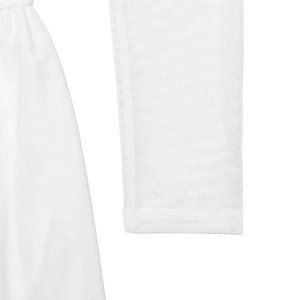 Detail of white mesh sleeve and stitching on an asymmetrical dress for women