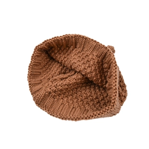 Brown knitted beanie for babies featuring ribbed trim and warm textured wool blend