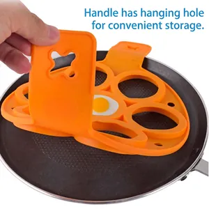 7-hole orange silicone egg ring mold with handles for pancakes and breakfast frying