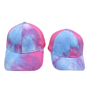 Pink and blue tie-dye mesh trucker caps for parents and kids in a two-piece set