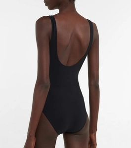 Macro detail of high-quality ribbed black fabric and deep U-shaped back design