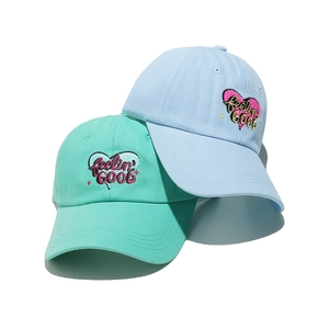 Minimalist cotton baseball caps in light blue and mint green with heart embroidery