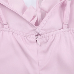 Detail of pink dress featuring adjustable straps and a hidden back zipper closure