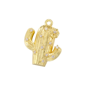 Detailed close-up of a gold cactus pendant with sparkling zircon inlays and tiny flower