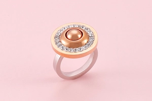 Macro shot of rose gold and silver dual-tone ring with sparkling zircon pavé