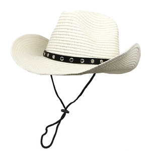 Detail of straw cowboy hat with silver rivets on black leather band and wind rope