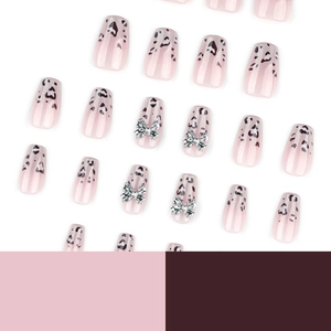 Pink gradient short coffin press-on nails featuring heart leopard print and silver bows