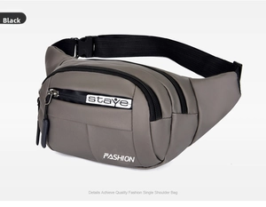 Detail of gray nylon waist bag showing the adjustable strap and buckle system