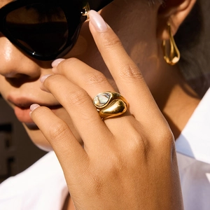 Detail of 18K gold stainless steel ring with colorful teardrop abalone shell on hand
