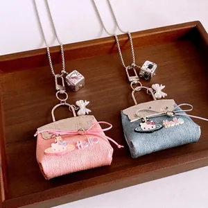 Titanium steel kitty bag pendant necklaces with woven pink and denim blue fabric textures