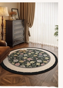 Detail of round floral rug with emerald rose pattern on parquet wood flooring