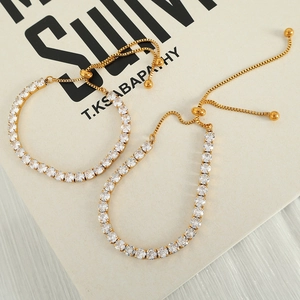 Adjustable golden tennis bracelet with round cubic zirconia and slider box chain