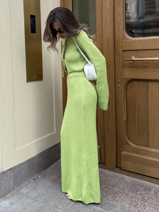 Detail of avocado green knit set featuring tie-up cardigan and slim maxi skirt