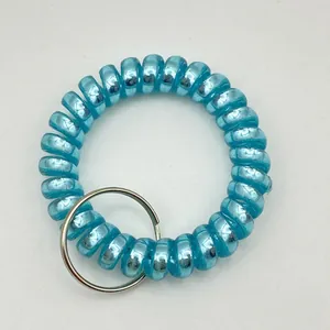 Close-up of matte royal blue spiral phone line keychain with a metal ring connector