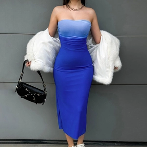 Detail of blue gradient tube midi dress paired with white faux fur jacket and bag