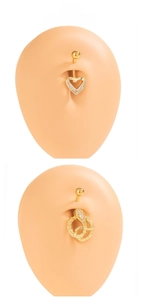 Close-up of heart and snake belly rings with rhinestones on a display model