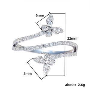 Elegant silver butterfly open ring with sparkling crystals on a clean white background
