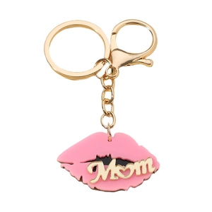 Pink acrylic lip keychain with golden Mom lettering and swivel clasp on white background