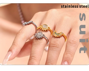 Detail of gold and silver sun and moon zircon rings in stainless steel on a model