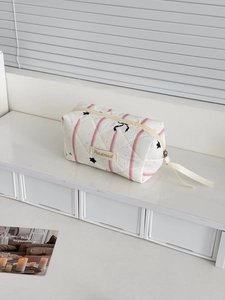 Pink starry sky geometric quilted makeup bag with handle and minimalist brand tag