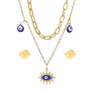 Parure de bijoux dorée avec collier à deux rangs et boucles d'oreilles œil bleu
