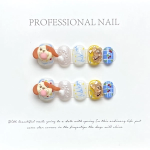 Handmade press-on nails featuring cute 3D zodiac dog, blue checkers, and cherry patterns