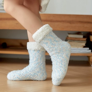 Thick light blue thermal floor socks with white fleece lining and soft knit texture