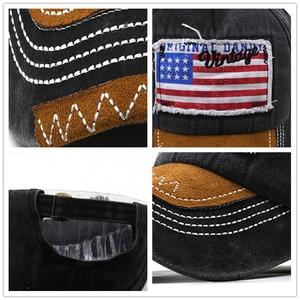 Close-up of vintage denim baseball cap showing suede trim and metal buckle detail