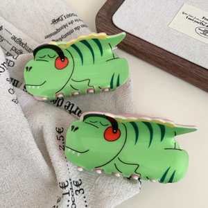Paire de pinces à cheveux dinosaures verts en acrylique avec finitions lisses et colorées