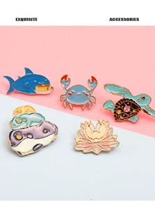 Detailed view of 5-piece cartoon enamel brooch set including shark, crab and frog pins